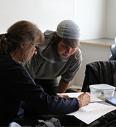 decorative - a photo of staff and student working together